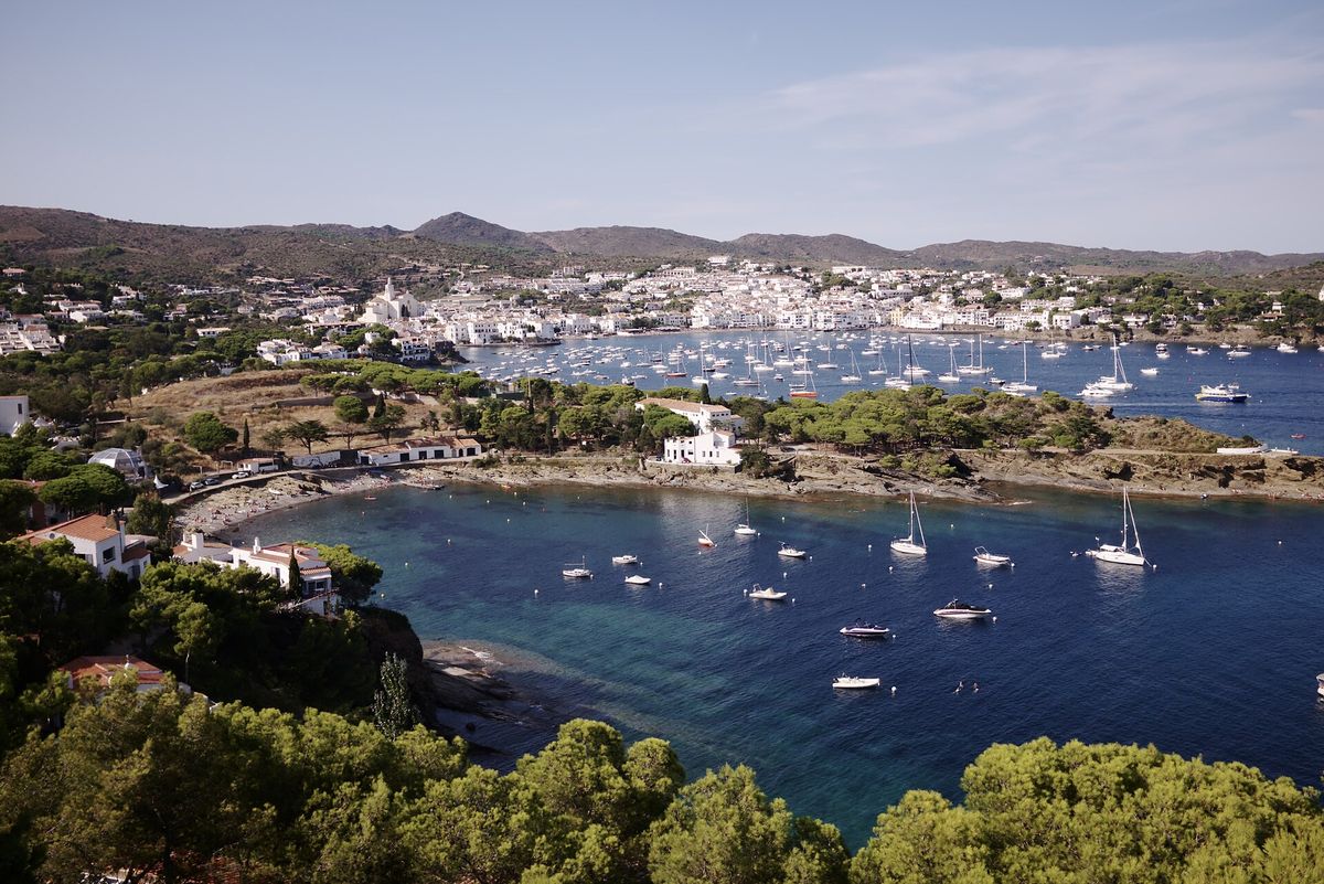 Cadaqués: the white village on its bay, sailing boats at anchor