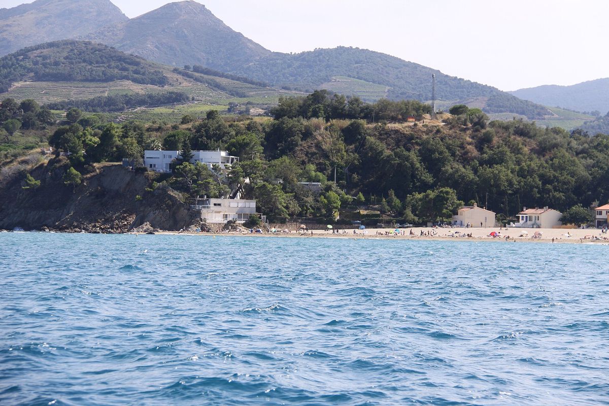 Le Racou beach and its houses at the foot of the Albères, seen from the sea