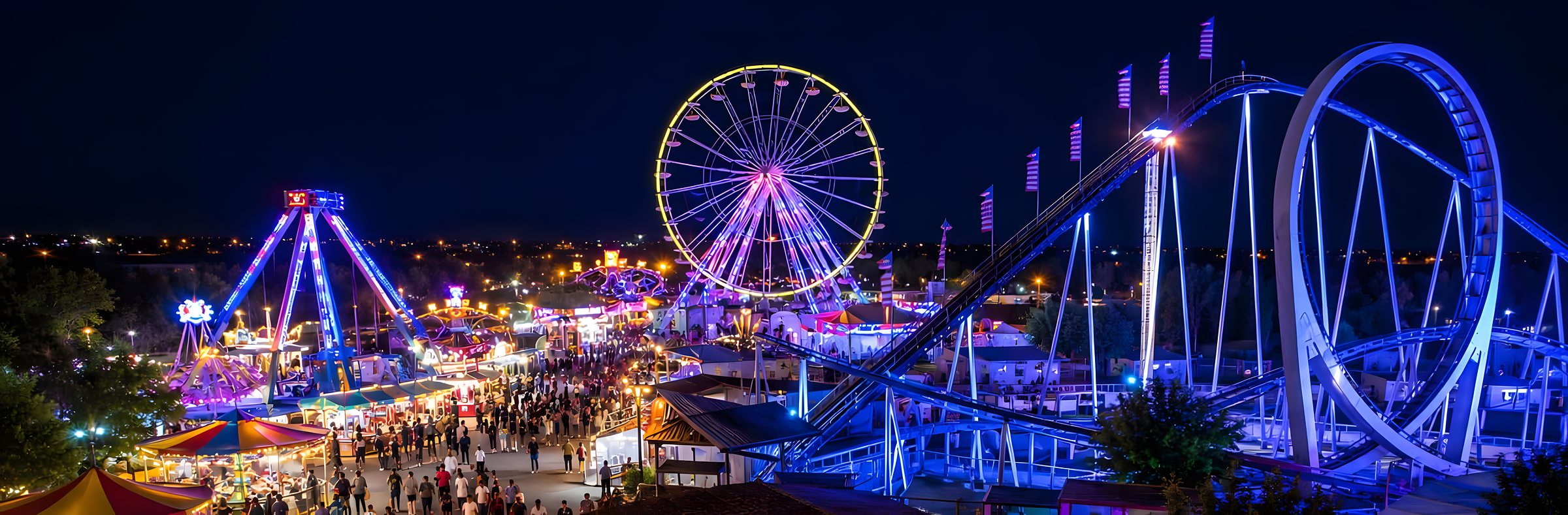 Reuzenrad en verlichte attracties 's nachts, feestelijke sfeer bij Argelès-sur-Mer